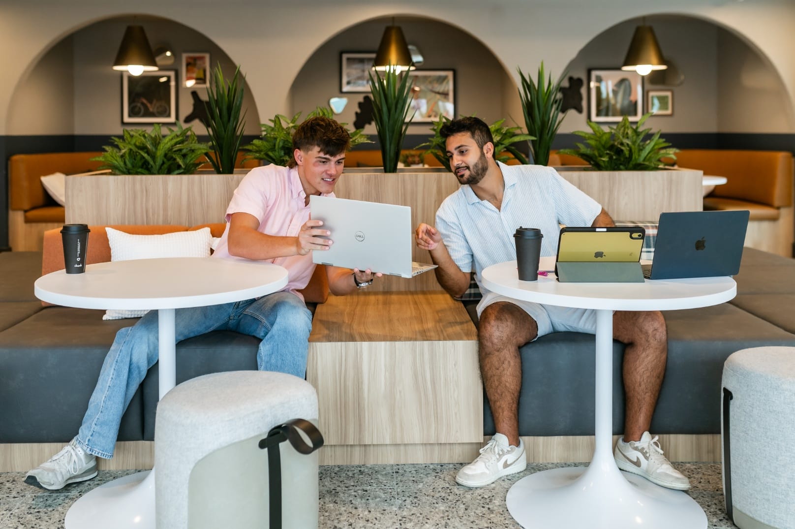 Two Aperture residents sharing ideas in the Coffee House